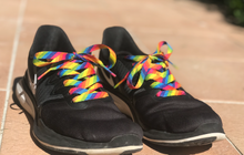 Load image into Gallery viewer, Rainbow shoelaces on black shoes from the school fundraising shop NZ.