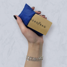 Load image into Gallery viewer, ZEROBAG - Blue Steel. Upcycled, super strong versatile Bag. Made in New Zealand. Look how small it is.